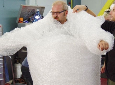 Man wrapped in bubble-wrap