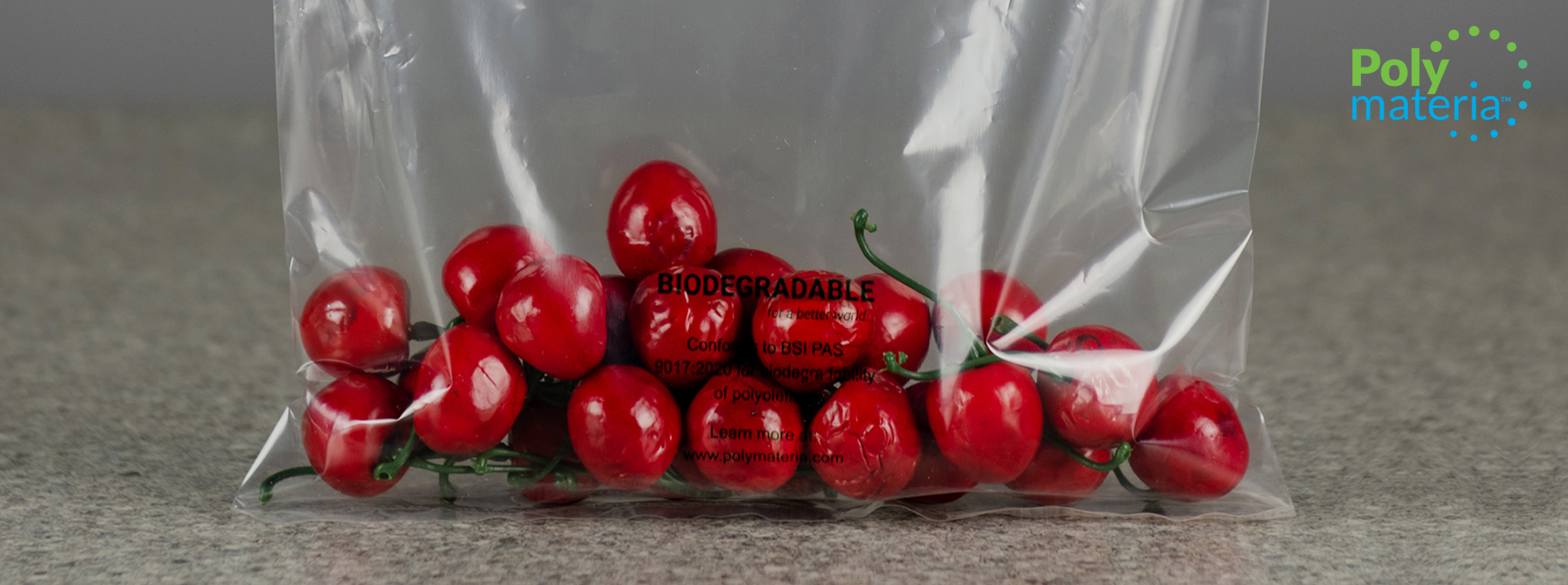 Biodegradable packing bag containing cherries