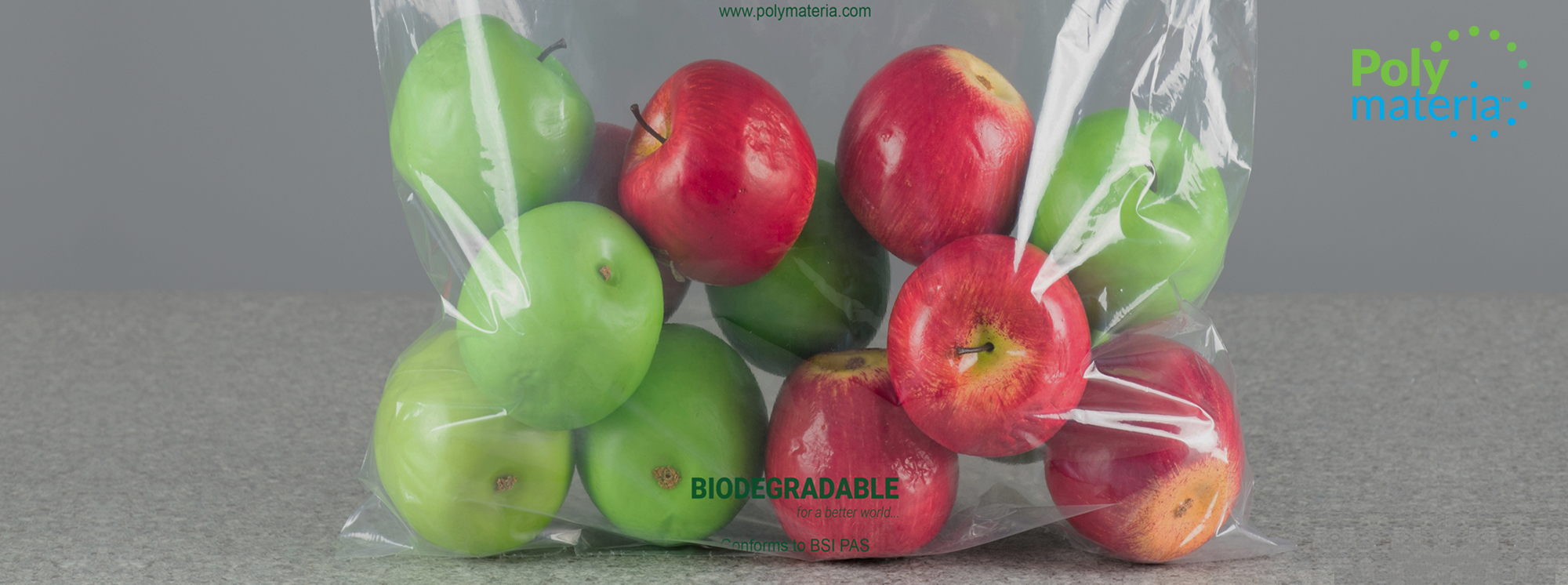 Biodegradable packing bag containing apples